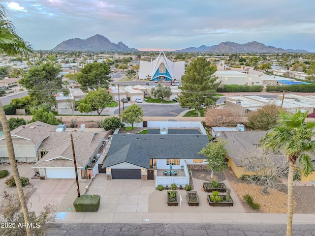 birds eye view of property with a mountain view