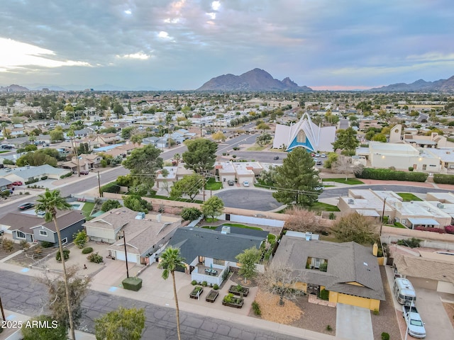 birds eye view of property with a mountain view