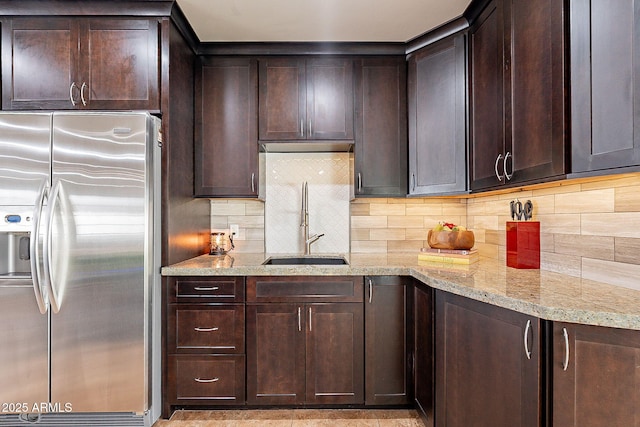 kitchen with dark brown cabinetry and stainless steel fridge with ice dispenser