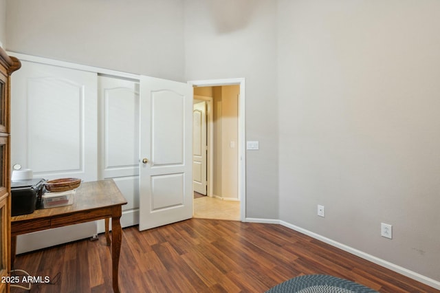 bedroom featuring hardwood / wood-style flooring and a closet