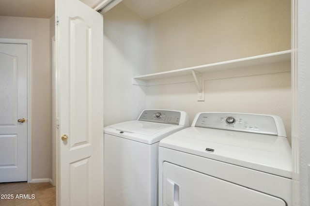 laundry area with tile patterned floors and washing machine and dryer