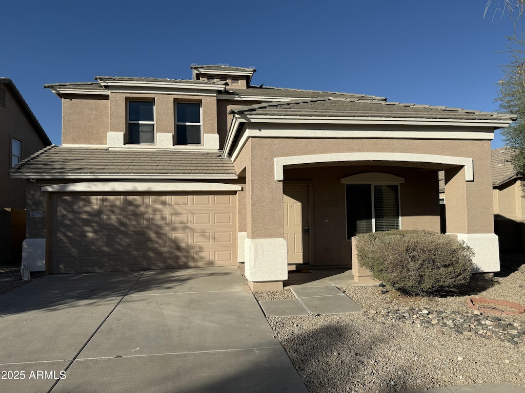 view of front of property with a garage