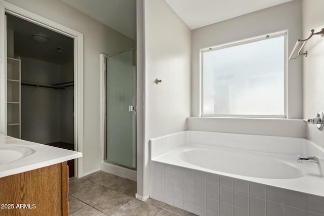 bathroom featuring vanity, a wealth of natural light, and shower with separate bathtub