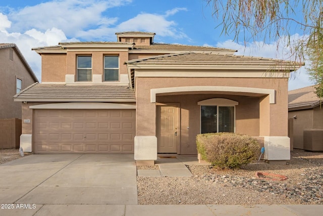 view of front of home with central AC and a garage