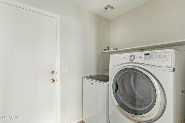 laundry area featuring washer and clothes dryer