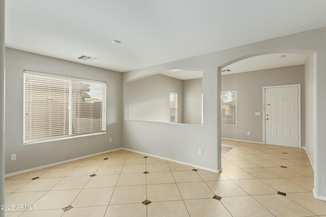 spare room featuring light tile patterned floors