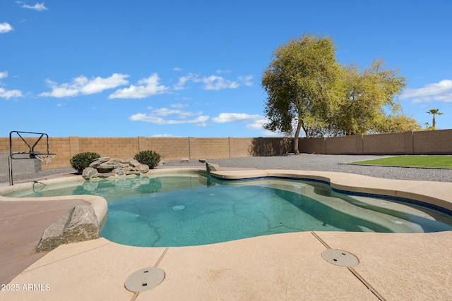 view of swimming pool featuring a patio area, a fenced backyard, and a fenced in pool