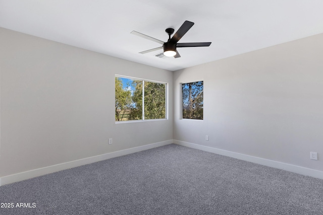 unfurnished room featuring carpet flooring, ceiling fan, and baseboards