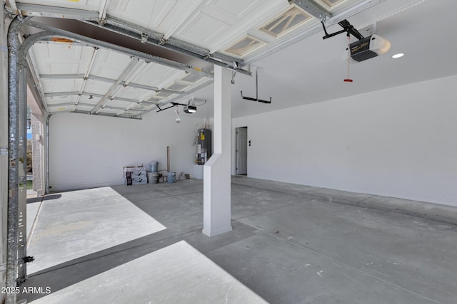 garage featuring water heater and a garage door opener