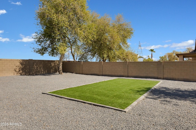 view of yard featuring a fenced backyard