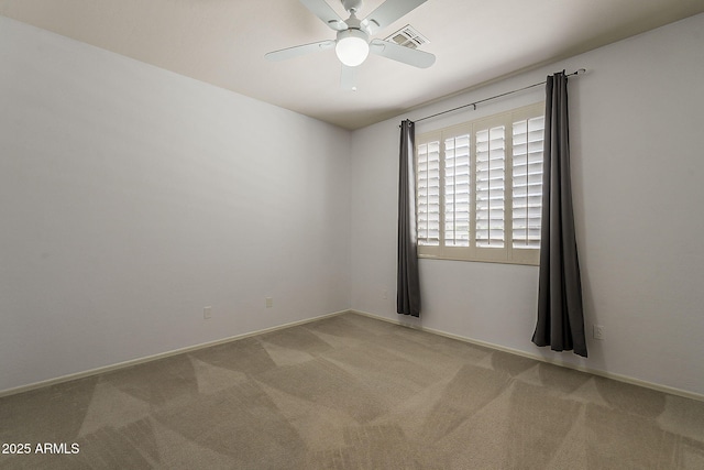unfurnished room featuring baseboards, carpet floors, visible vents, and a ceiling fan