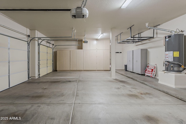 garage featuring water heater and a garage door opener