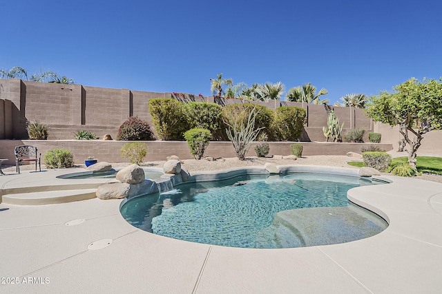 view of swimming pool with a patio, a fenced in pool, and a fenced backyard