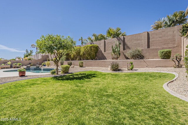 view of yard featuring a fenced in pool and a fenced backyard