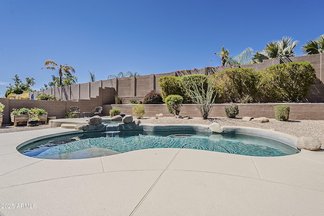 view of pool with a fenced backyard, a patio, and a fenced in pool