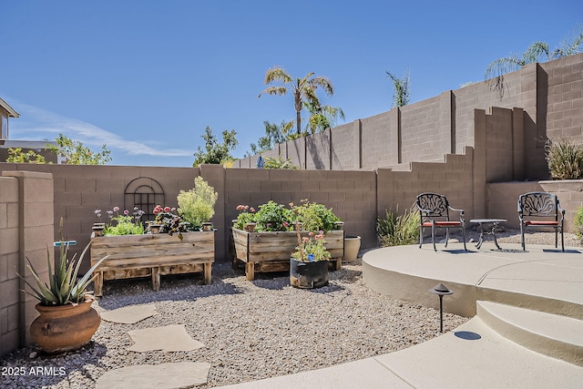 view of patio featuring fence