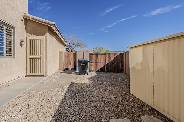 view of yard with a gate and fence