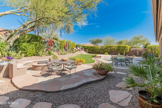 view of patio with an outdoor fire pit