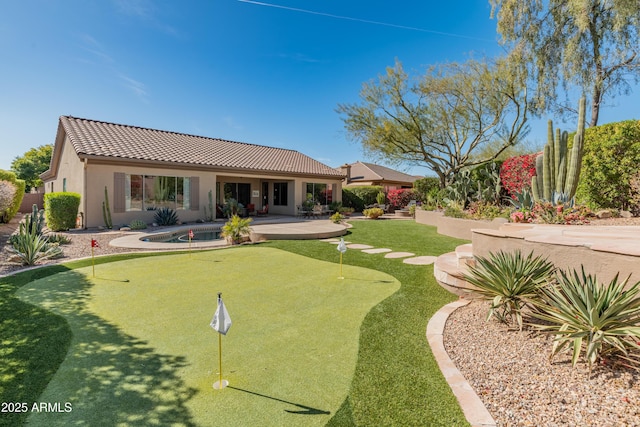 back of property with a patio area