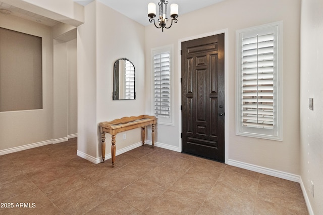 foyer with a notable chandelier