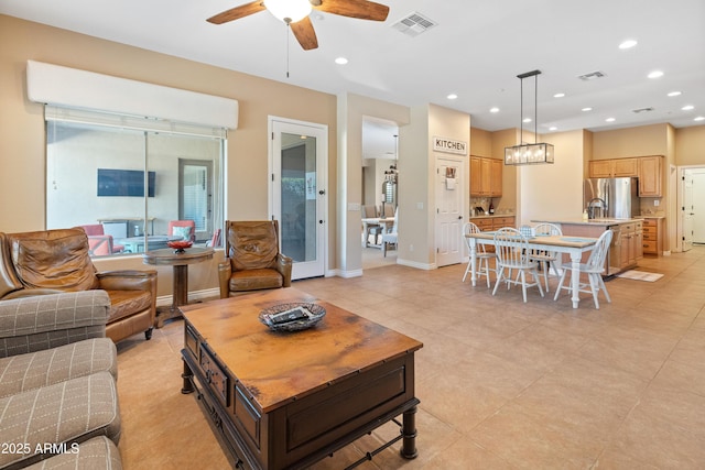 living room with sink and ceiling fan