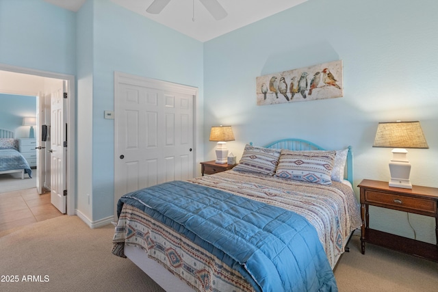 carpeted bedroom with a closet and ceiling fan