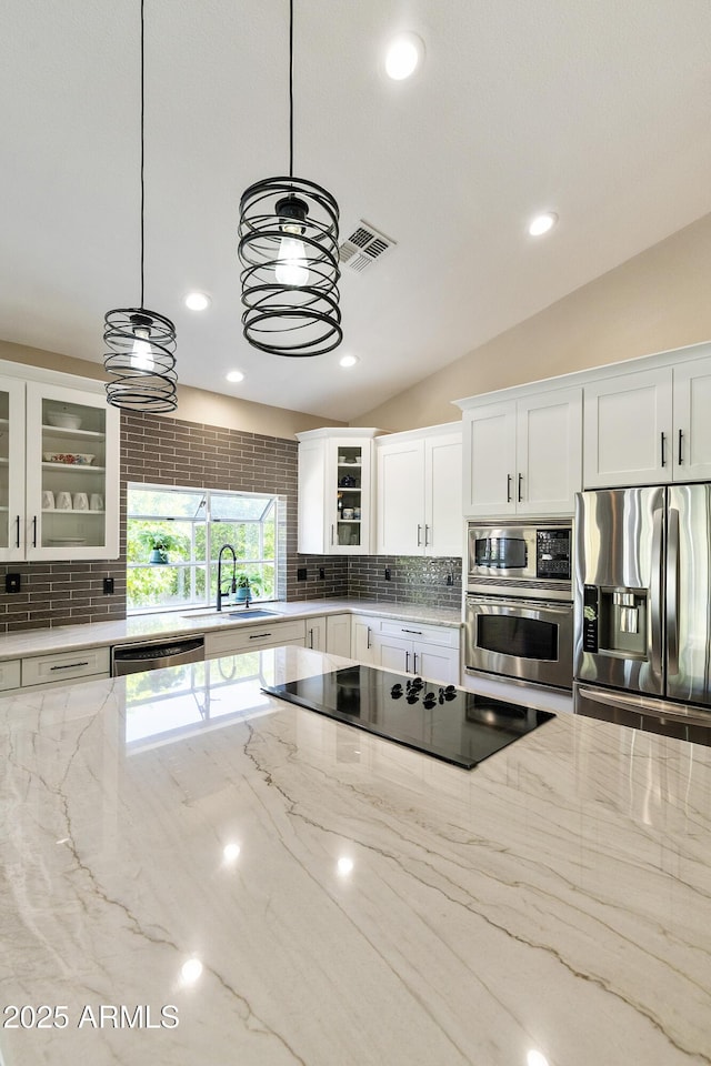25042 S Hollygreen Dr, Sun Lakes, AZ 85248 - kitchen with stainless steel appliances, visible vents, a sink, and tasteful backsplash