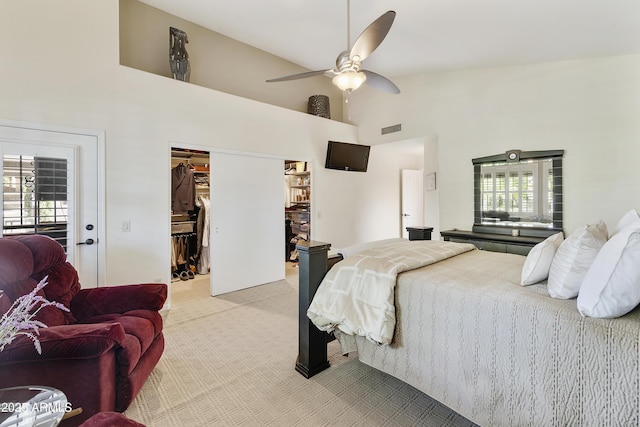 25042 S Hollygreen Dr, Sun Lakes, AZ 85248 - bedroom featuring a walk in closet, a ceiling fan, visible vents, high vaulted ceiling, and light carpet
