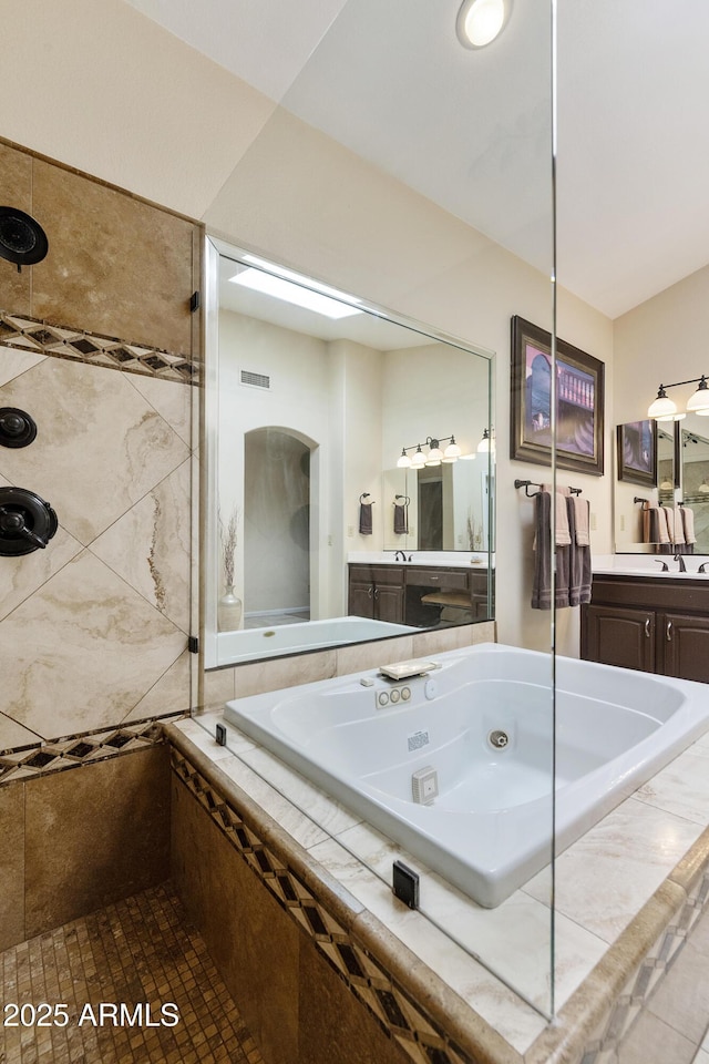 25042 S Hollygreen Dr, Sun Lakes, AZ 85248 - bathroom with visible vents, vanity, tiled shower, and a jetted tub