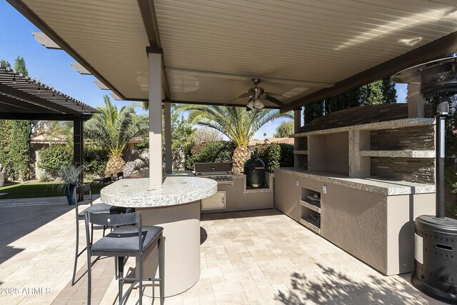 25042 S Hollygreen Dr, Sun Lakes, AZ 85248 - view of patio / terrace featuring outdoor wet bar, grilling area, and an outdoor kitchen