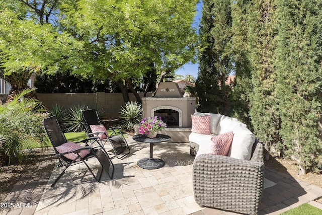 25042 S Hollygreen Dr, Sun Lakes, AZ 85248 - view of patio / terrace featuring fence and an outdoor living space with a fireplace