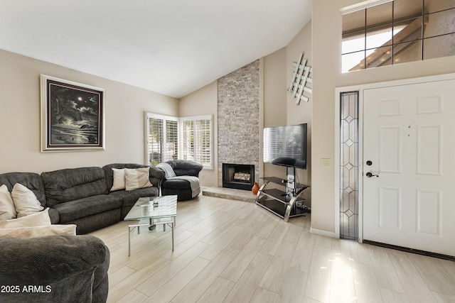 25042 S Hollygreen Dr, Sun Lakes, AZ 85248 - living room featuring high vaulted ceiling, baseboards, a fireplace, and light wood-type flooring