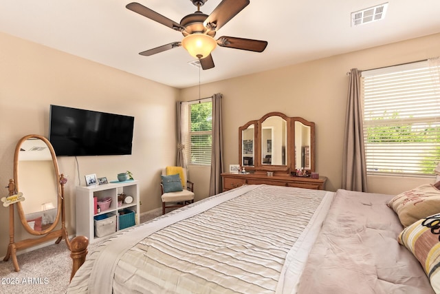 bedroom with carpet floors, a ceiling fan, and baseboards