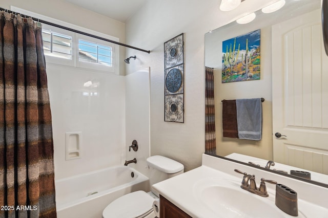 bathroom featuring vanity, shower / bath combo with shower curtain, and toilet