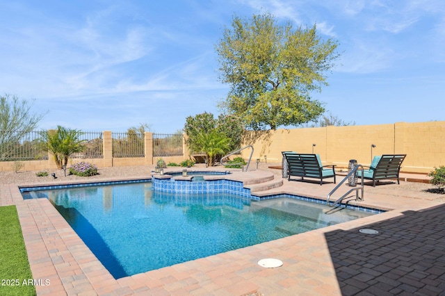 view of pool featuring a patio area, a fenced backyard, and a pool with connected hot tub