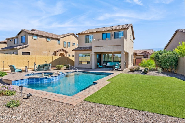 exterior space with a patio, a fenced backyard, a balcony, an outdoor hangout area, and a yard