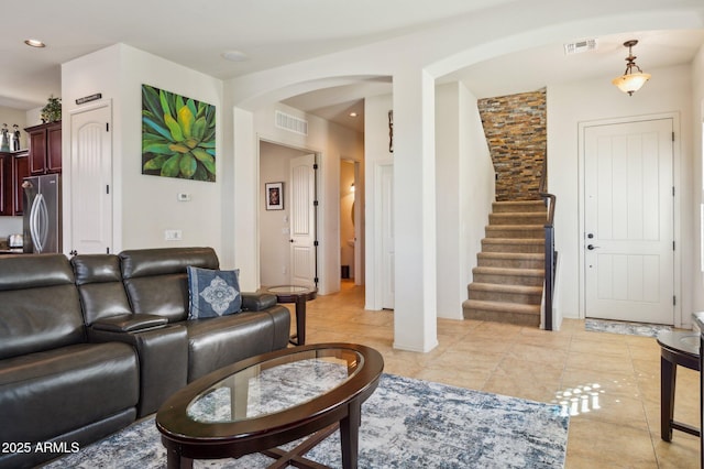 living room with stairway, light tile patterned floors, visible vents, and recessed lighting