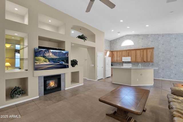 living room with high vaulted ceiling, a fireplace, tile patterned floors, and ceiling fan