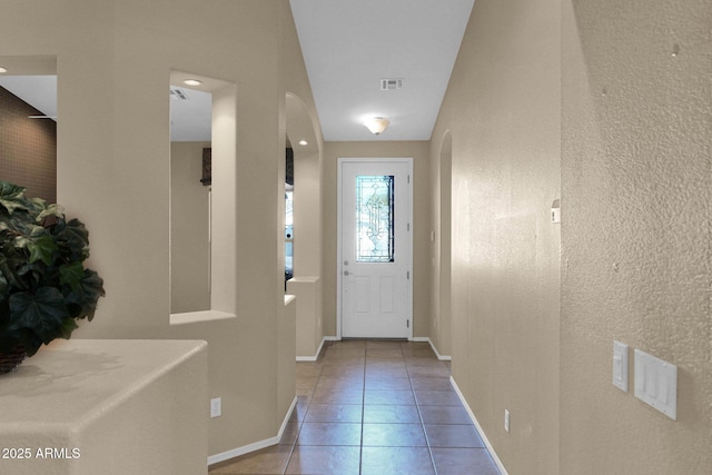 doorway featuring light tile patterned floors