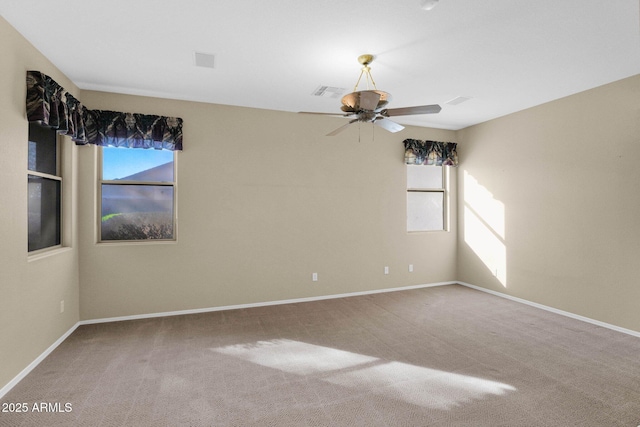 empty room featuring ceiling fan and carpet floors