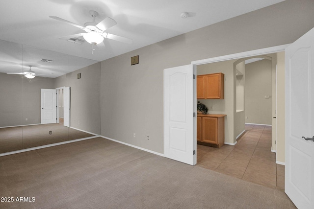 carpeted empty room with ceiling fan