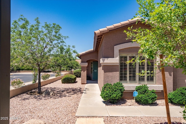 4976 S Sugarberry Ln, Gilbert, AZ 85298 - view of front facade featuring stucco siding and a tiled roof