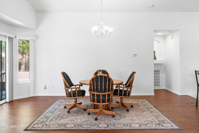 4976 S Sugarberry Ln, Gilbert, AZ 85298 - dining area with wood finished floors, a chandelier, and baseboards