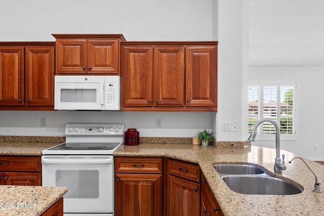 4976 S Sugarberry Ln, Gilbert, AZ 85298 - kitchen featuring white appliances, a sink, light stone counters, and backsplash