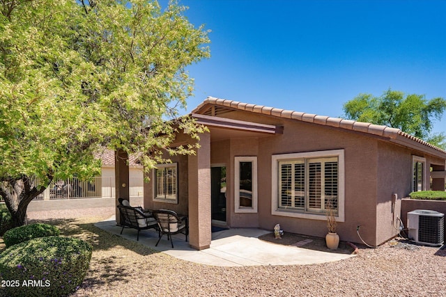 4976 S Sugarberry Ln, Gilbert, AZ 85298 - rear view of property with central AC, stucco siding, fence, and a patio