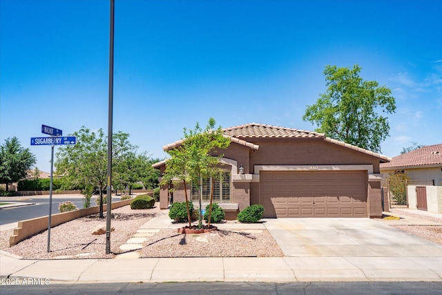 4976 S Sugarberry Ln, Gilbert, AZ 85298 - mediterranean / spanish home featuring a garage, a tile roof, stucco siding, concrete driveway, and fence