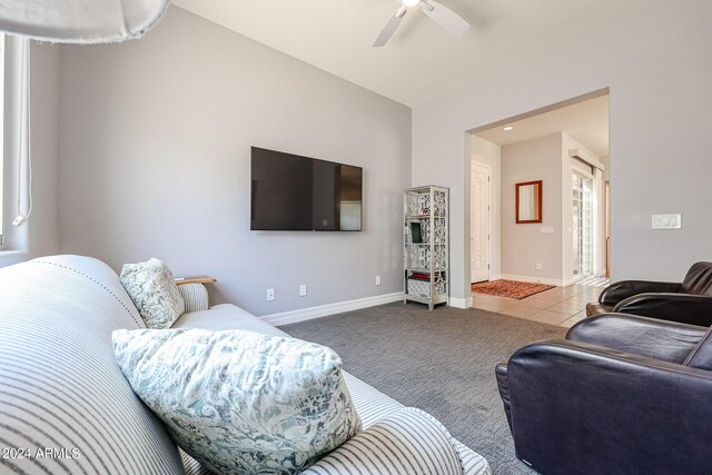 living room with ceiling fan and carpet floors