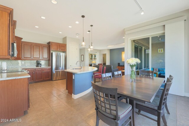 dining area with tile patterned floors and ceiling fan