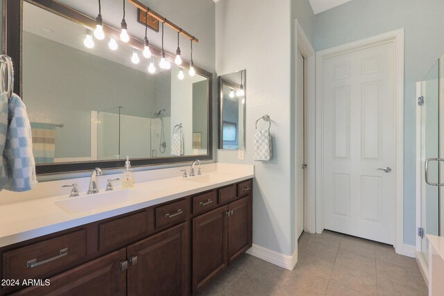 bathroom with plus walk in shower, tile patterned flooring, and vanity