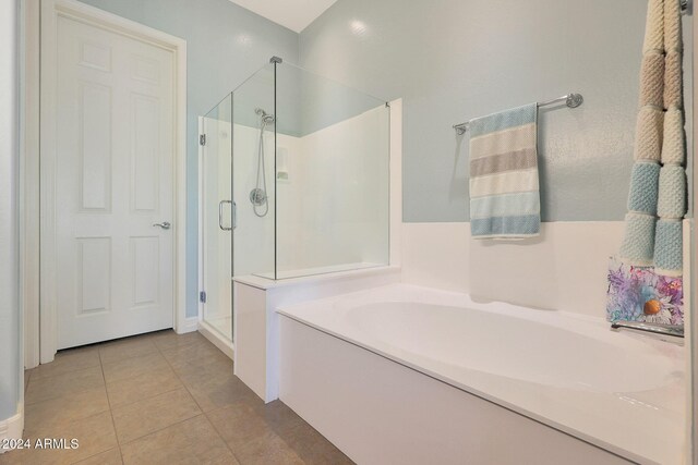 bathroom featuring tile patterned flooring, vanity, and an enclosed shower